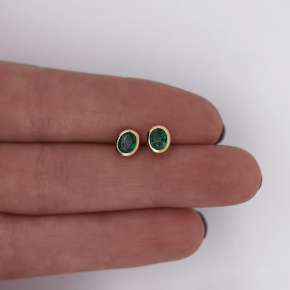 0.50 Carat Oval Emerald Bezel Set 18K Gold Stud Earrings
