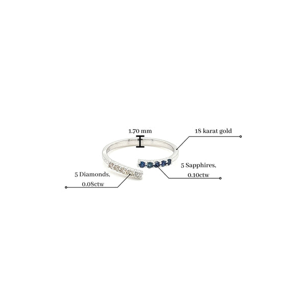 Bague fine croisée en or blanc 18 carats avec saphir bleu et diamants