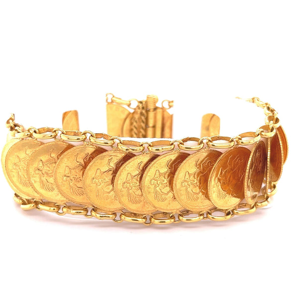 alt
Bracelet en pièce d'or de la Royal Mint britannique de 1911, à l'effigie de George V, en or 22k | Réplique