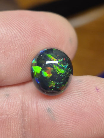 6 Carat Australian Black Opal in a 4-Prong White Gold Mounting – Assay Jewelers