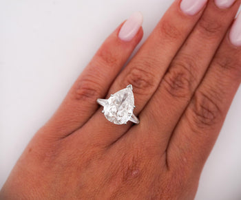 GIA Certified 7.03 Carat Pear Cut F/SI2 Diamond Platinum 3 Stone Ring – Assay Jewelers