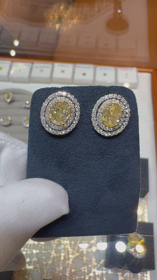 3.73 Carat TW Oval Cut Fancy Yellow Diamond Double Halo Stud Earrings